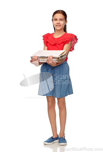 Image of smiling girl with magazines sorting paper waste