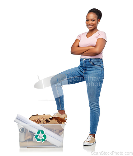 Image of happy african american woman sorting paper waste