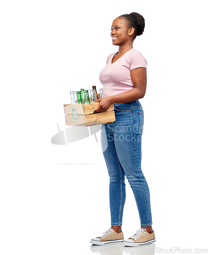 Image of happy african american woman sorting glass waste