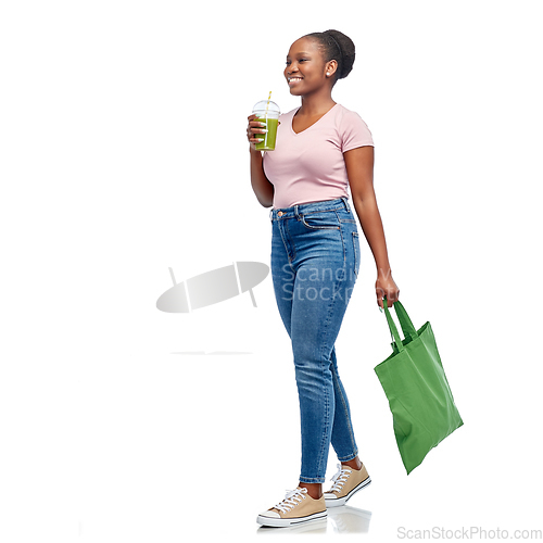Image of happy woman with drink and food in reusable bag