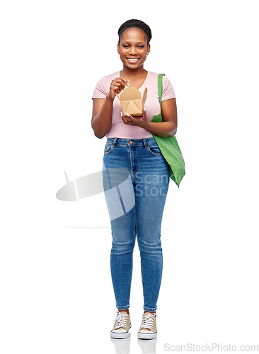 Image of happy woman with reusable bag for food and wok