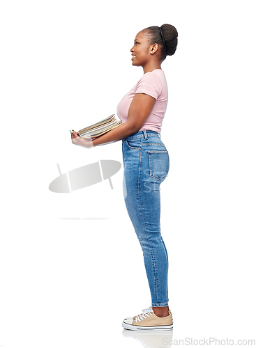 Image of smiling african american woman sorting paper waste