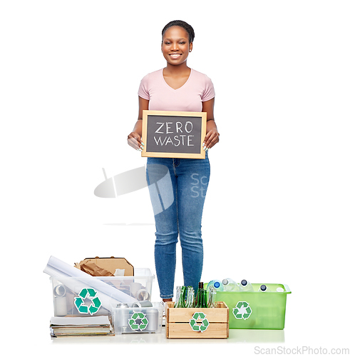 Image of happy woman sorting paper, metal and plastic waste