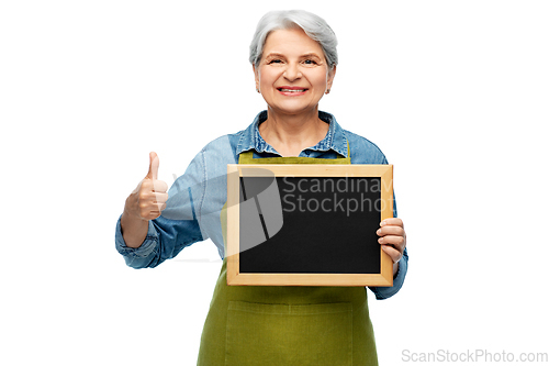 Image of senior gardener with chalkboard showing thumbs up