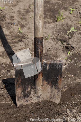 Image of old metal rusty shovel,