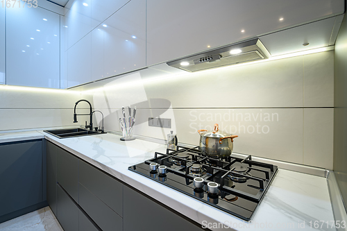 Image of Closeup to luxury gray modern kitchen interior