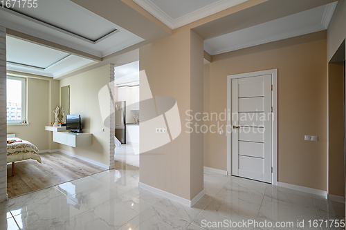 Image of Modern studio apartment with white kitchen in classic style