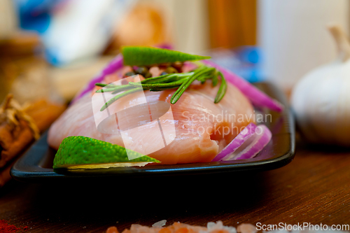 Image of fresh organic chicken breast with herbs and spices