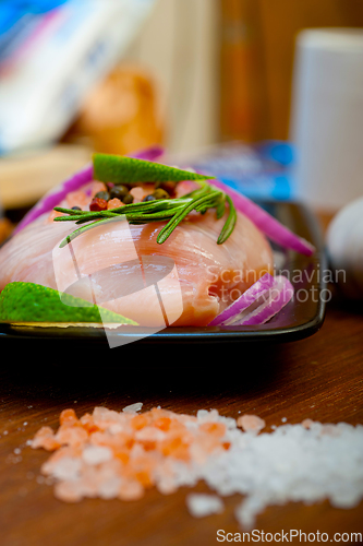 Image of fresh organic chicken breast with herbs and spices