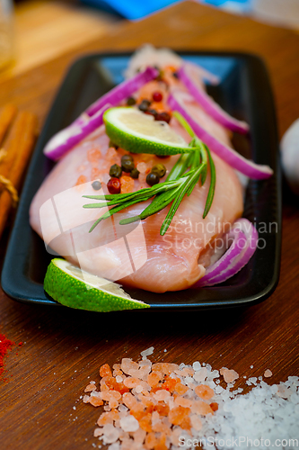 Image of fresh organic chicken breast with herbs and spices