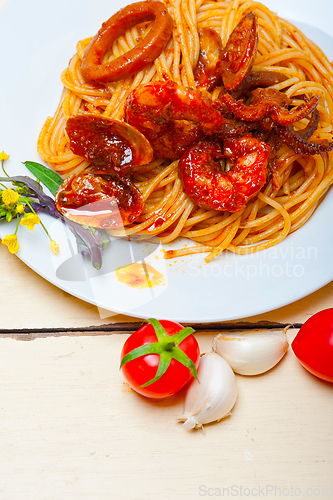 Image of Italian seafood spaghetti pasta on red tomato sauce