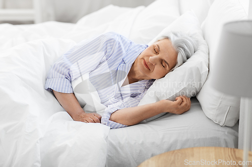 Image of senior woman sleeping in bed at home bedroom