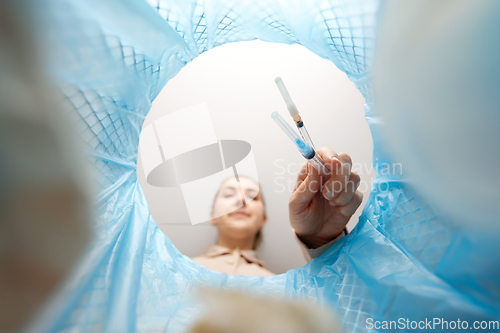 Image of woman throwing used syringes into trash can