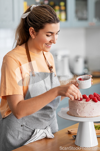 Image of woman cooking food and baking on kitchen at home