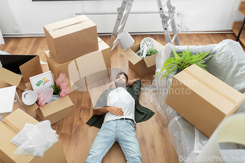 Image of man with boxes moving to new home