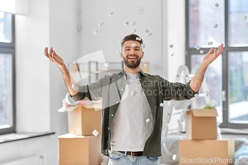 Image of happy man with foam peanut moving to new home