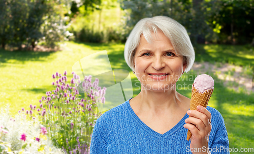 Image of portrait of smiling senior woman with ice cream