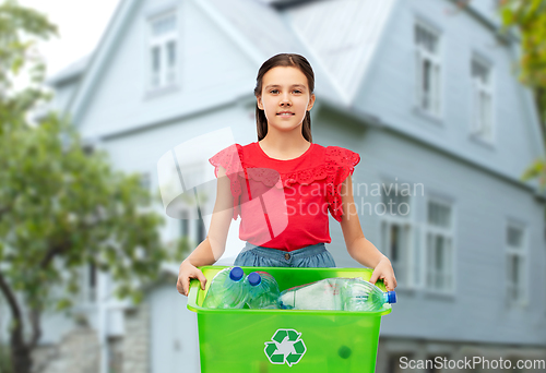 Image of smiling girl sorting plastic waste