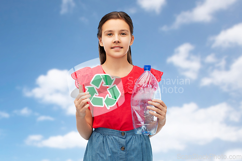 Image of girl with green recycling sign and plastic bottle