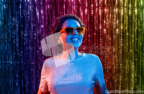 Image of african woman in sunglasses at party