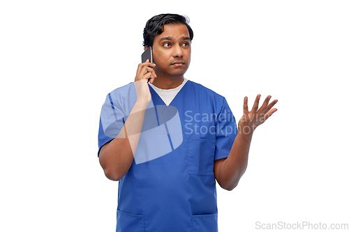 Image of indian doctor or male nurse calling on smartphone