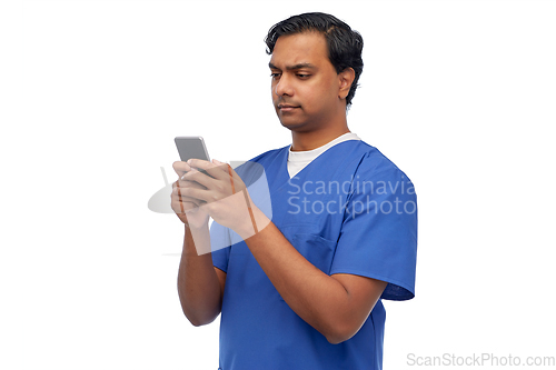 Image of indian doctor or male nurse using smartphone