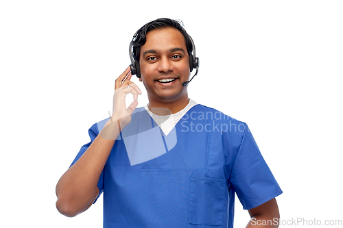 Image of smiling indian doctor or male nurse with headset