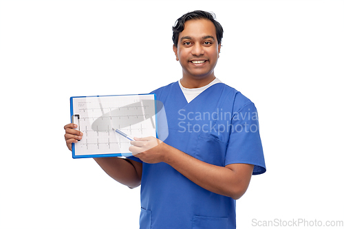 Image of smiling male doctor with cardiogram on clipboard