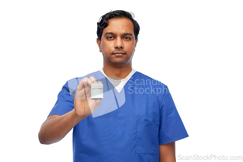 Image of indian doctor or male nurse holding medicine