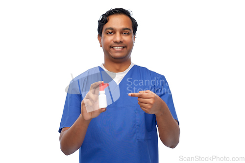 Image of smiling indian male doctor or nurse with medicine
