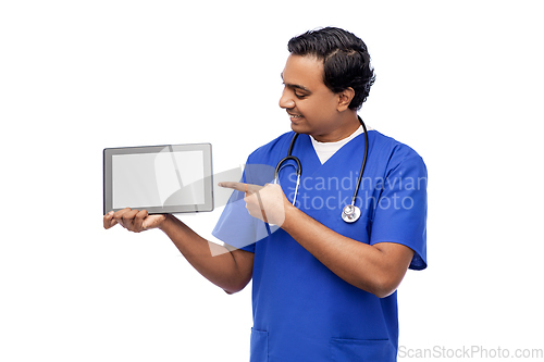 Image of happy doctor or male nurse showing tablet computer