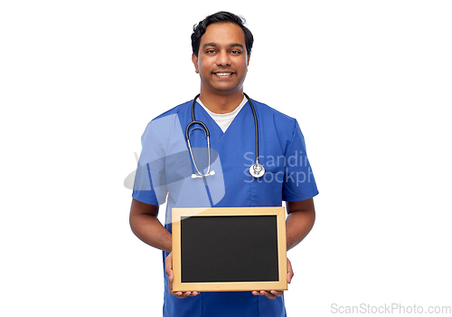 Image of happy indian male doctor or nurse with chalkboard