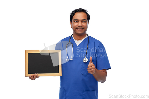 Image of happy indian male doctor or nurse with chalkboard