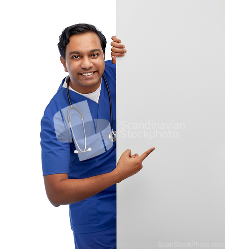 Image of smiling male doctor or nurse with big white board