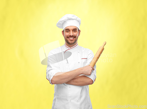 Image of happy smiling male chef or baker with rolling pin