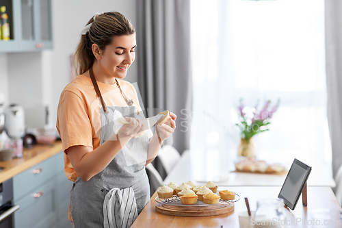 Image of woman cooking food and baking on kitchen at home