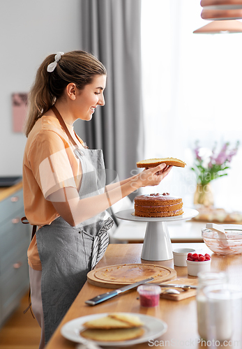 Image of woman cooking food and baking on kitchen at home