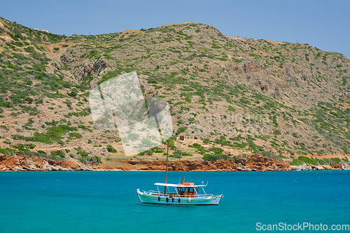 Image of Greek traditional fishing boat in sea. Crete island, Greece