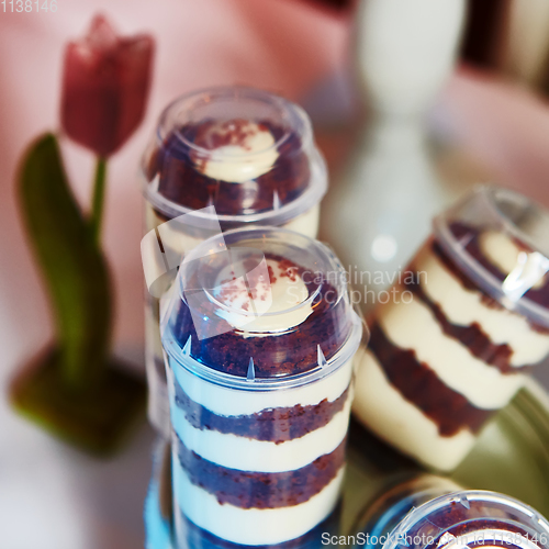 Image of Selection of decorative desserts on buffet table at catered event