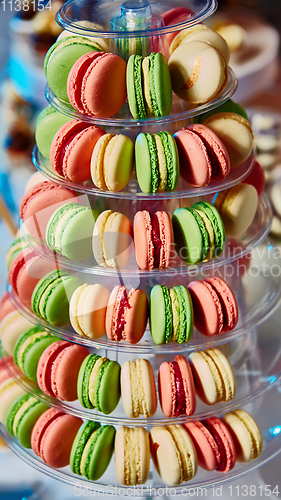 Image of Selection of decorative desserts on buffet table at catered event