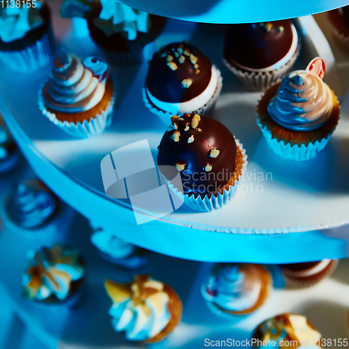 Image of Selection of decorative desserts on buffet table at catered event