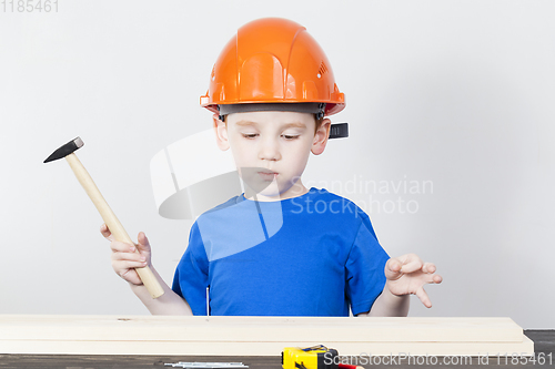 Image of boy hammering nail