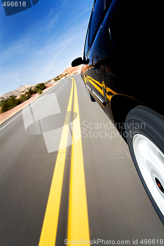 Image of car driving on mountain road