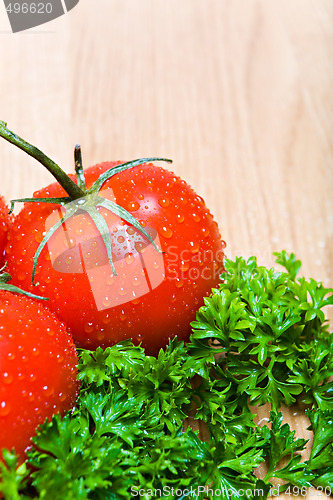 Image of tomatoes and parsley on countertop