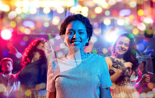 Image of african woman over neon lights at nightclub