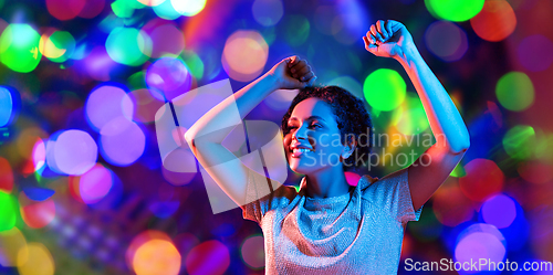 Image of african american woman dancing over neon lights