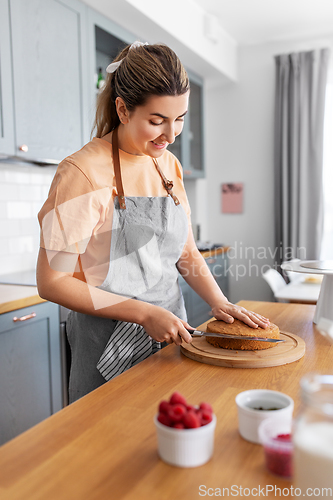 Image of woman cooking food and baking on kitchen at home