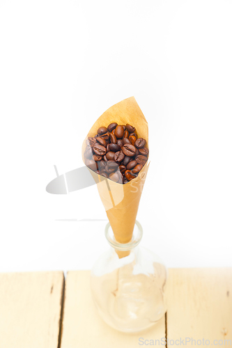 Image of espresso coffee beans on a paper cone