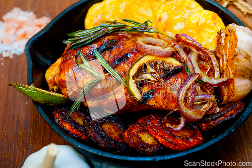 Image of roasted grilled BBQ chicken breast with herbs and spices