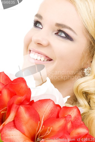 Image of happy woman with lily flowers